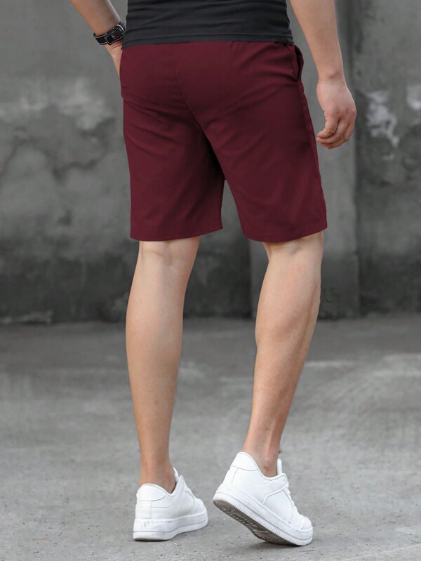 Loose fit men's shorts, monogram patch, drawstring waist Loose fit men's shorts, monogram patch, drawstring waist