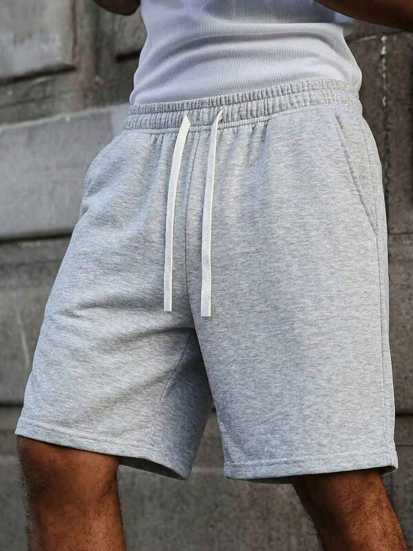 Men's solid color loose shorts, elastic waistband and drawstring, summer beach wear, men's casual and breathable summer clothing, suitable as a Father's Day gift